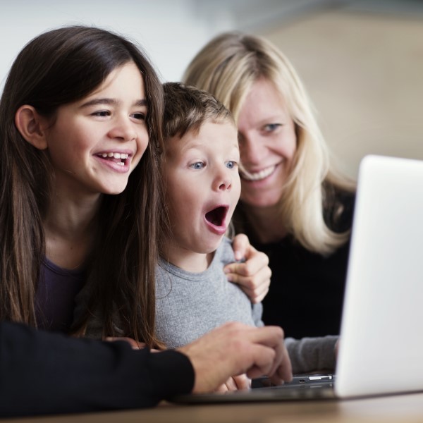 family looking at computer