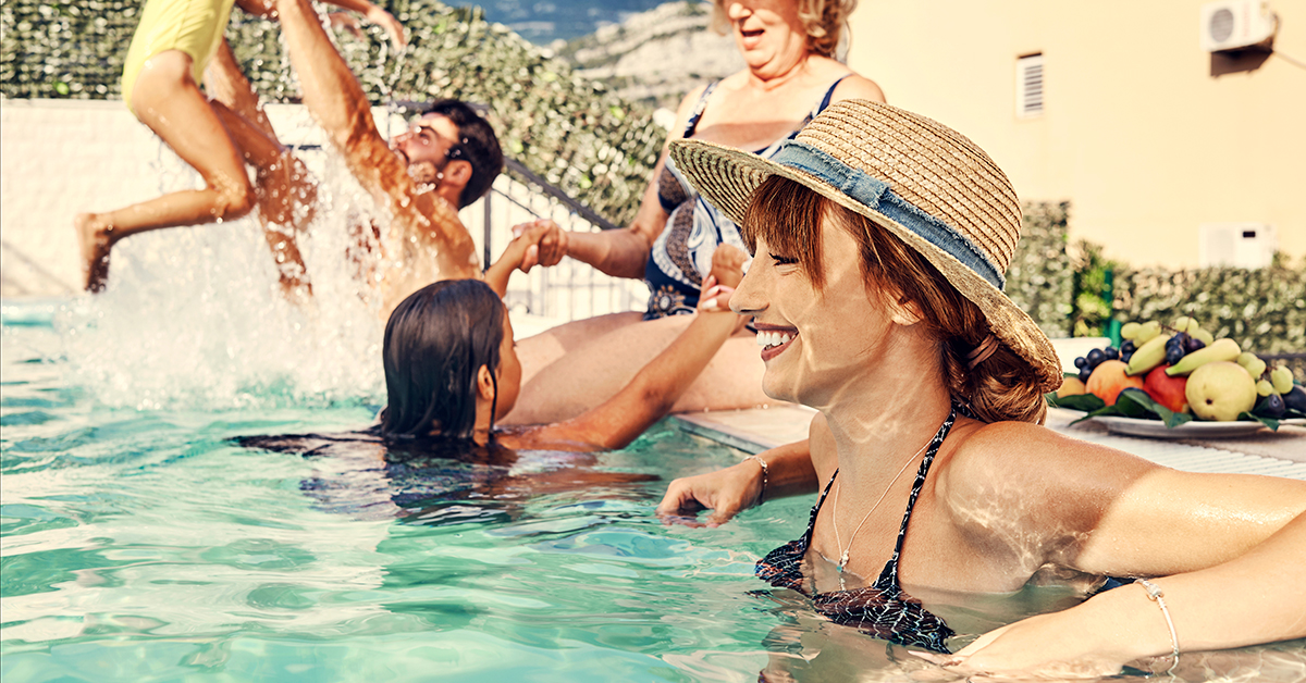 family in swimming pool together