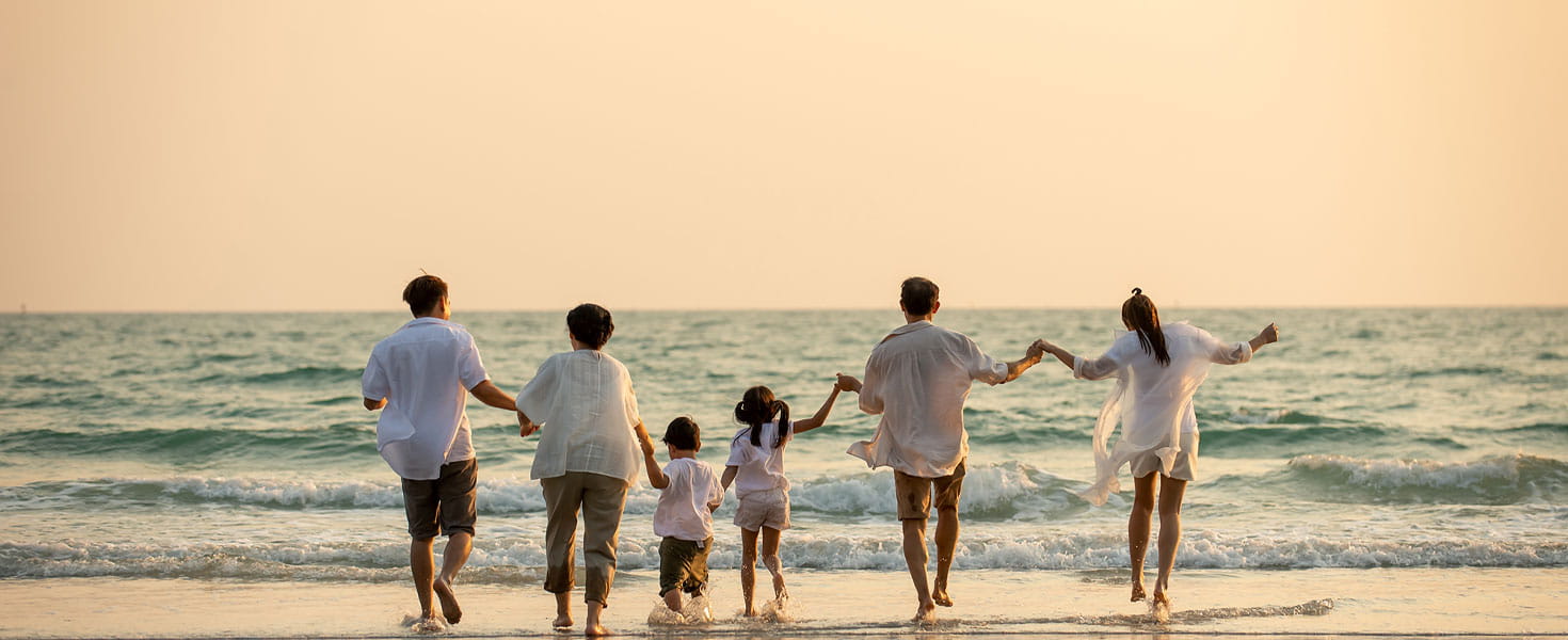 family walking on beach