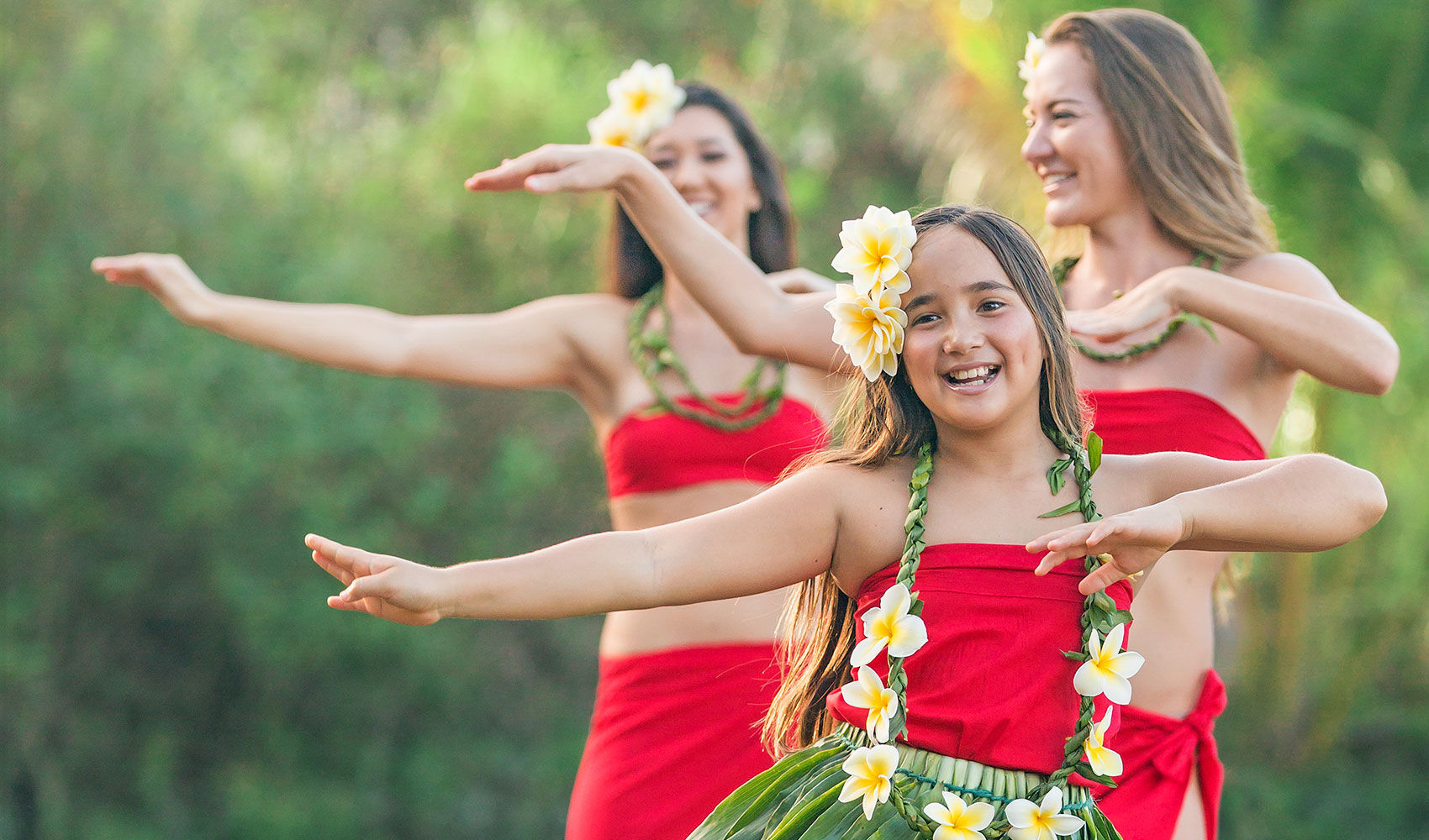 Three girls doing the hula dance