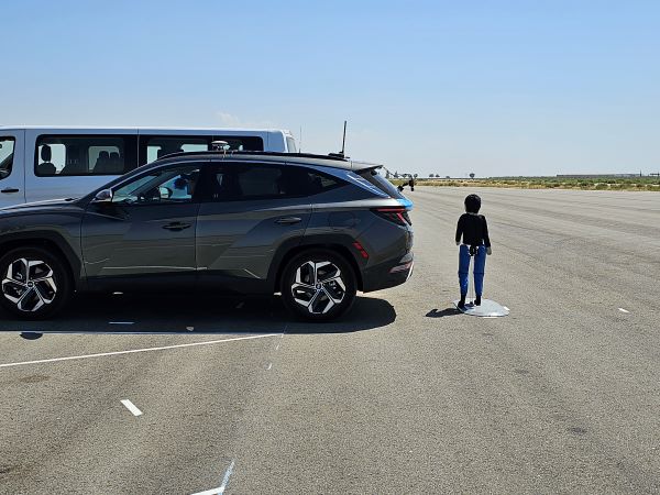 Testing with a stationary child target behind the vehicle